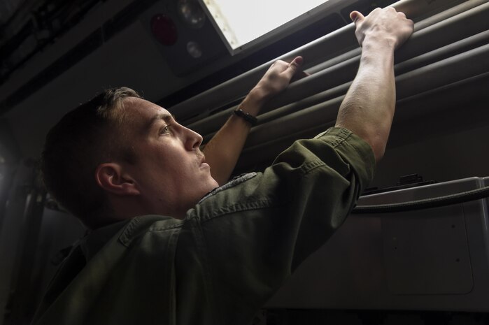 Staff Sgt. Dungan Farver, 16th Airlift Squadron loadmaster, performs a preflight inspection prior to the takeoff of one of the final C-17 Globemaster IIIs out of Joint Base Charleston, South Carolina in preparation for Hurricane Irma Sept. 8, 2017.