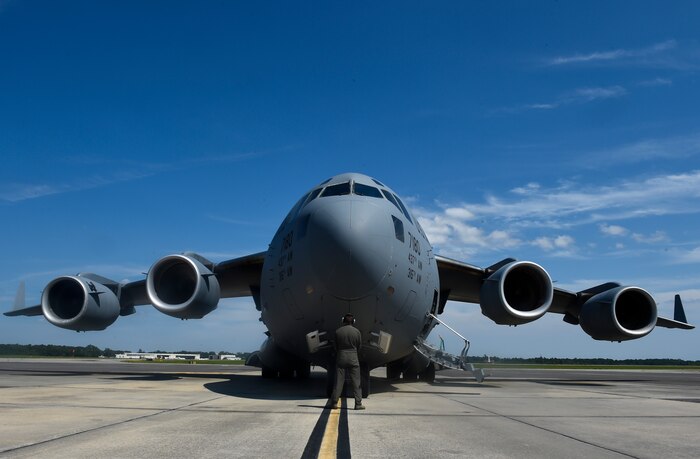 Staff Sgt. Drew Gayhart, 16th Airlift Squadron loadmaster, performs a final inspection prior to the takeoff of one of the final C-17 Globemaster IIIs out of Joint Base Charleston in preparation for Hurricane Irma Sept. 8, 2017.