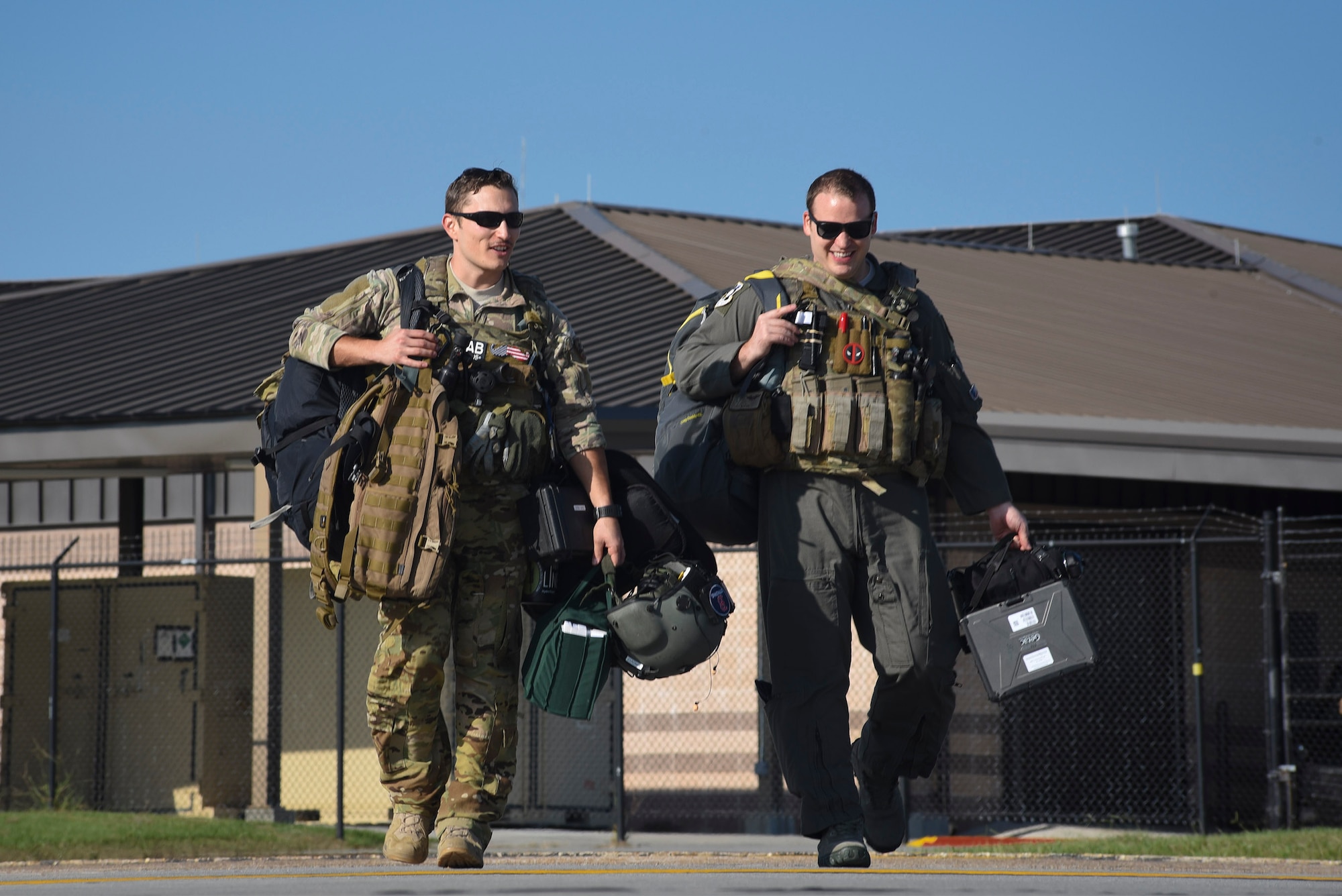 Moody 41st Rescue Squadron HH-60G Pavehawk pilots walk the flighline prior to take off, Sept. 9, 2017, at Moody Air Force Base, Ga. Team Moody aircraft and rescue assets travelled to Columbus Air Force Base, Miss., for shelter before re-engaging with other Moody assets to assist the Federal Emergency Management Agency and other first responder agencies during upcoming Hurricane Irma in the Southeast region. (U.S. Air Force photo by Senior Airman Greg Nash)