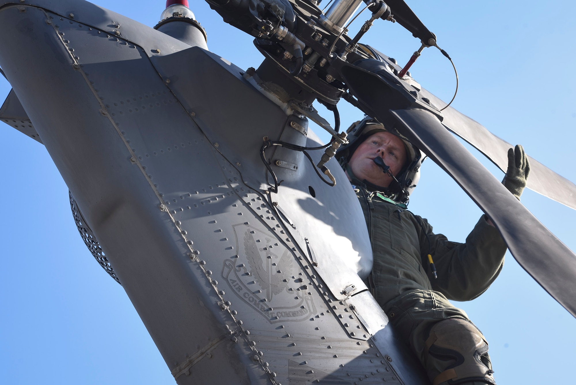 Tech. Sgt. Paul Hiller, 41st Rescue Squadron flight engineer, performs a pre-flight inspection on an HH-60G Pavehawk prior to takeoff, Sept. 9, 2017, at Moody Air Force Base, Ga. Team Moody aircraft and rescue assets travelled to Columbus Air Force Base, Miss., for shelter before re-engaging with other Moody assets to assist the Federal Emergency Management Agency and other first responder agencies during upcoming Hurricane Irma in the Southeast region. (U.S. Air Force photo by Senior Airman Greg Nash)