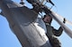 Tech. Sgt. Paul Hiller, 41st Rescue Squadron flight engineer, performs a pre-flight inspection on an HH-60G Pavehawk prior to takeoff, Sept. 9, 2017, at Moody Air Force Base, Ga. Team Moody aircraft and rescue assets travelled to Columbus Air Force Base, Miss., for shelter before re-engaging with other Moody assets to assist the Federal Emergency Management Agency and other first responder agencies during upcoming Hurricane Irma in the Southeast region. (U.S. Air Force photo by Senior Airman Greg Nash)