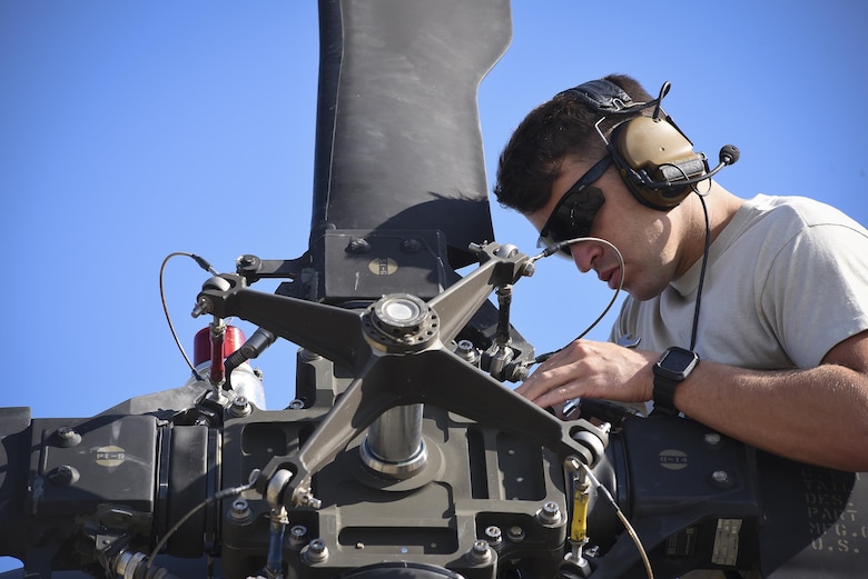 An Airman from the 41st Helicopter Maintenance Unit performs maintenance on an HH-60G Pavehawk prior to takeoff, Sept. 9, 2017, at Moody Air Force Base, Ga. Team Moody aircraft and rescue assets travelled to Columbus Air Force Base, Miss., for shelter before re-engaging with other Moody assets to assist the Federal Emergency Management Agency and other first responder agencies during upcoming Hurricane Irma in the Southeast region. (U.S. Air Force photo by Senior Airman Greg Nash)