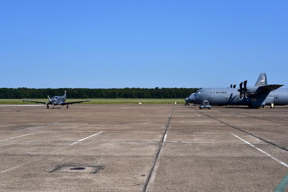 A U-28A assigned to Hurlburt Field, Fla., taxis past C-130Js to a parking spot after landing Sept. 9, 2017, at Little Rock Air Force Base, Ark.