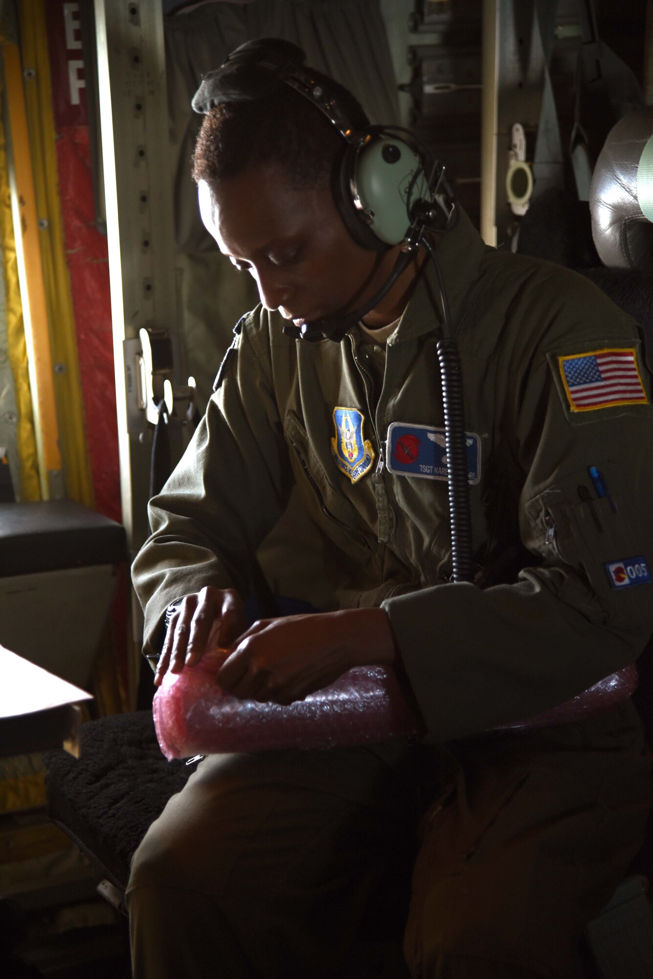 Tech. Sgt. Karen Moore, a loadmaster for the 53rd Weather Reconnaissance Squadron, prepares a dropsonde to be released into the eyewall of Hurricane Irma. Crews have been flying missions continuously in three different hurricanes in the Atlantic region simultaneously. (U.S. Air Force photo by: Staff Sgt. Nicholas Monteleone)