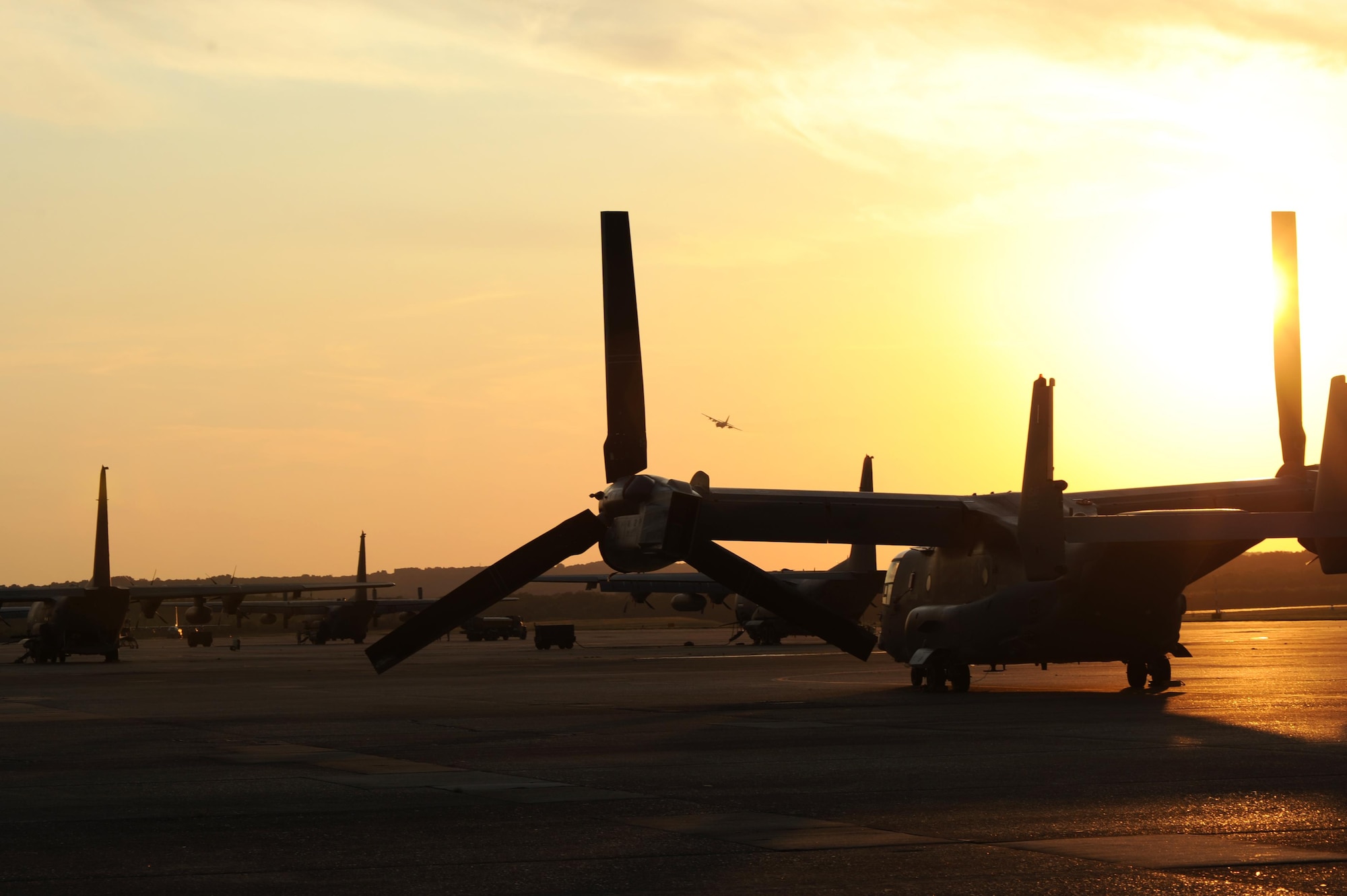 A CV-22 Osprey, along with other aircraft assigned to Hurlburt Field, Fla., is parked on the flightline after landing Sept. 9, 2017, at Little Rock Air Force Base, Ark. The aircraft is capable of extremely accurate navigation due to the fully integrated navigation systems with dual inertial navigation systems and global positioning system. (U.S. Air Force photo by Airman 1st Class Grace Nichols)