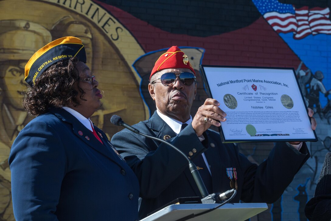 Nobitee Giles, a U.S. Marine Corps Montford Point veteran, receives the United States Congressional Gold medal in recognition for his service during Marine Week Detroit, Sept. 9, 2017. Marine Week Detroit is a chance to connect with our Marines, Sailors, veterans and their families from different generations. (U.S. Marine Corps photo by Lance Cpl. Danny Gonzalez)