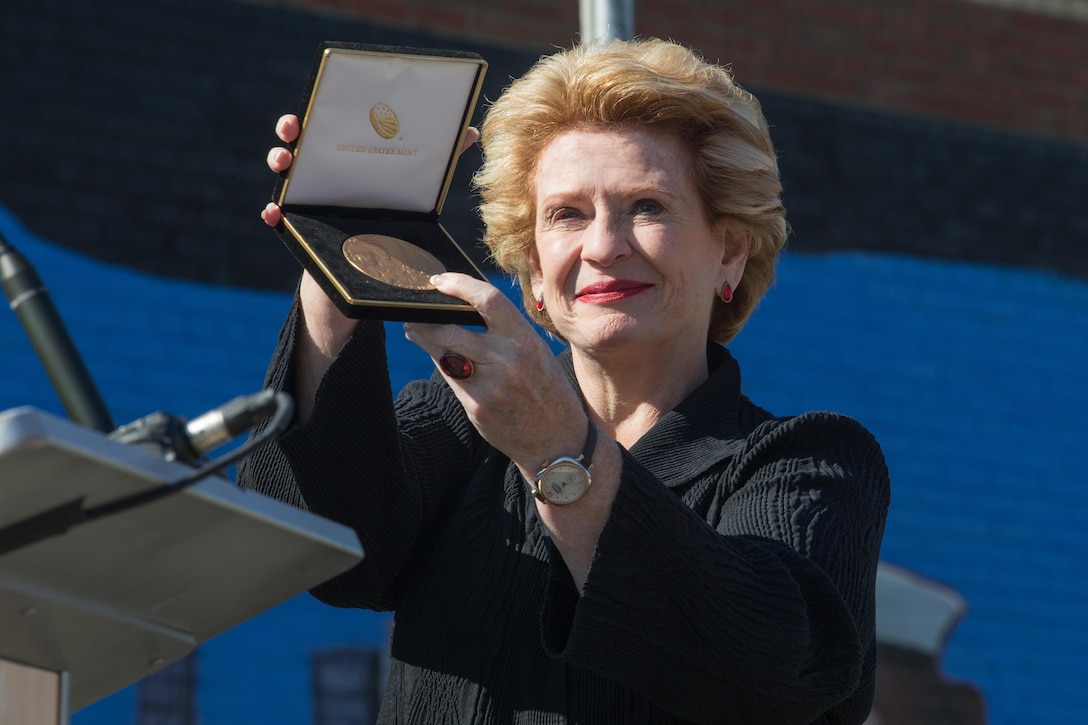 U.S. Sen. Debbie Stabenow holds up the United States Congress Congressional Gold medal, the highest award a civilian can receive, during Marine Week Detroit, Sept. 9, 2017. Marine Week Detroit celebrates the contributions of local Marines whose service to our nation has protected and preserved our way of life for hundreds of years. (U.S. Marine Corps photo by Lance Cpl. Danny Gonzalez)