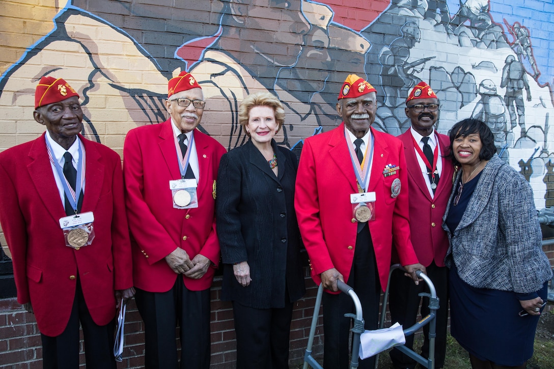 U.S. Sen. Debbie Stabenow, Montford Point Marines, and Lamar Harrington, commandant of Montford Point Detachment 158, and his wife, pose for a photo during Marine Week Detroit, Sept. 9, 2017. Marine Week Detroit is an opportunity to connect with the people of the greater Detroit area, and thank them for their support. (U.S. Marine Corps photo by Lance Cpl. Danny Gonzalez)