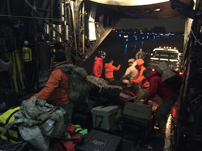 U.S. Air Force Guardian Angel pararescuemen from the 212th Rescue Squadron, Alaska Air National Guard, unload their equipment from an MC130P Combat Shadow aircraft assigned to the 129th Rescue Wing for support during Hurricane Irma.