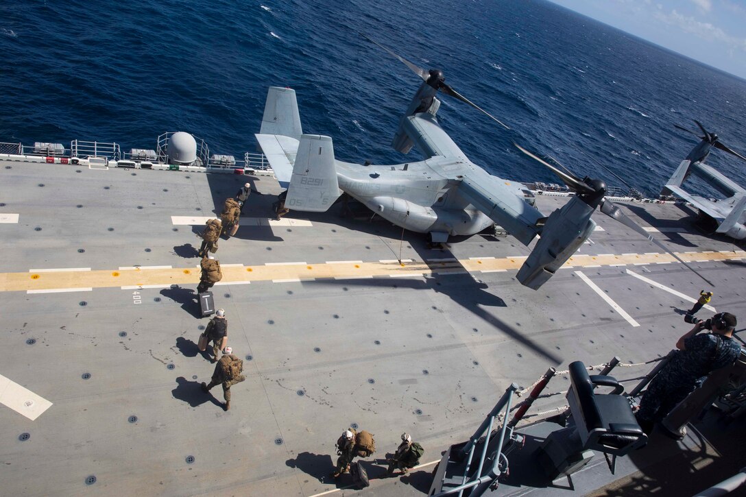 U.S. Marines with the 26th Marine Expeditionary Unit (MEU), board an MV-22B Osprey aboard amphibious assault ship USS Kearsarge to coordinate and establish operations with the Federal Emergency Management Agency (FEMA) and other services operating at St. Croix, U.S. Virgin Islands, as a Forward Coordination Element, in the Caribbean Sea, Sept. 9, 2017. The 26th MEU is ready to respond to any requests to bolster Northern Command's support of FEMA assistance to federal, state and local authorities' ongoing efforts in the aftermath of Hurricane Irma.  (U.S. Marine Corps photo by Cpl. Juan A. Soto-Delgado)