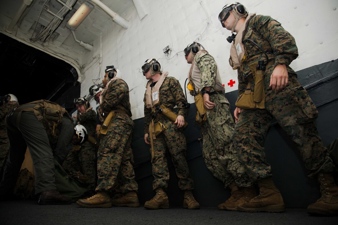 U.S. Marines with the 26th Marine Expeditionary Unit (MEU), prepare to board an MV-22B Osprey aircraft aboard amphibious assault ship USS Kearsarge (LHD 3) prior their departure to coordinate and establish operations with the Federal Emergency Management Agency (FEMA) and other services operating at St. Croix, U.S. Virgin Islands, as a Forward Coordination Element, in the Caribbean Sea, Sept. 9, 2017. The 26th MEU is ready to respond to any requests to bolster Northern Command's support of FEMA assistance to federal, state and local authorities' ongoing efforts in the aftermath of Hurricane Irma.  (U.S. Marine Corps photo by Lance Cpl. Alexis C. Schneider)