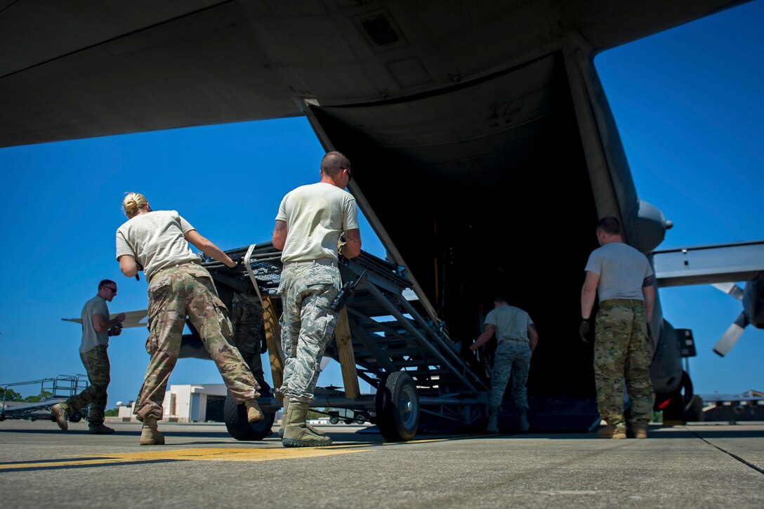 Air Commandos load up an aircraft.