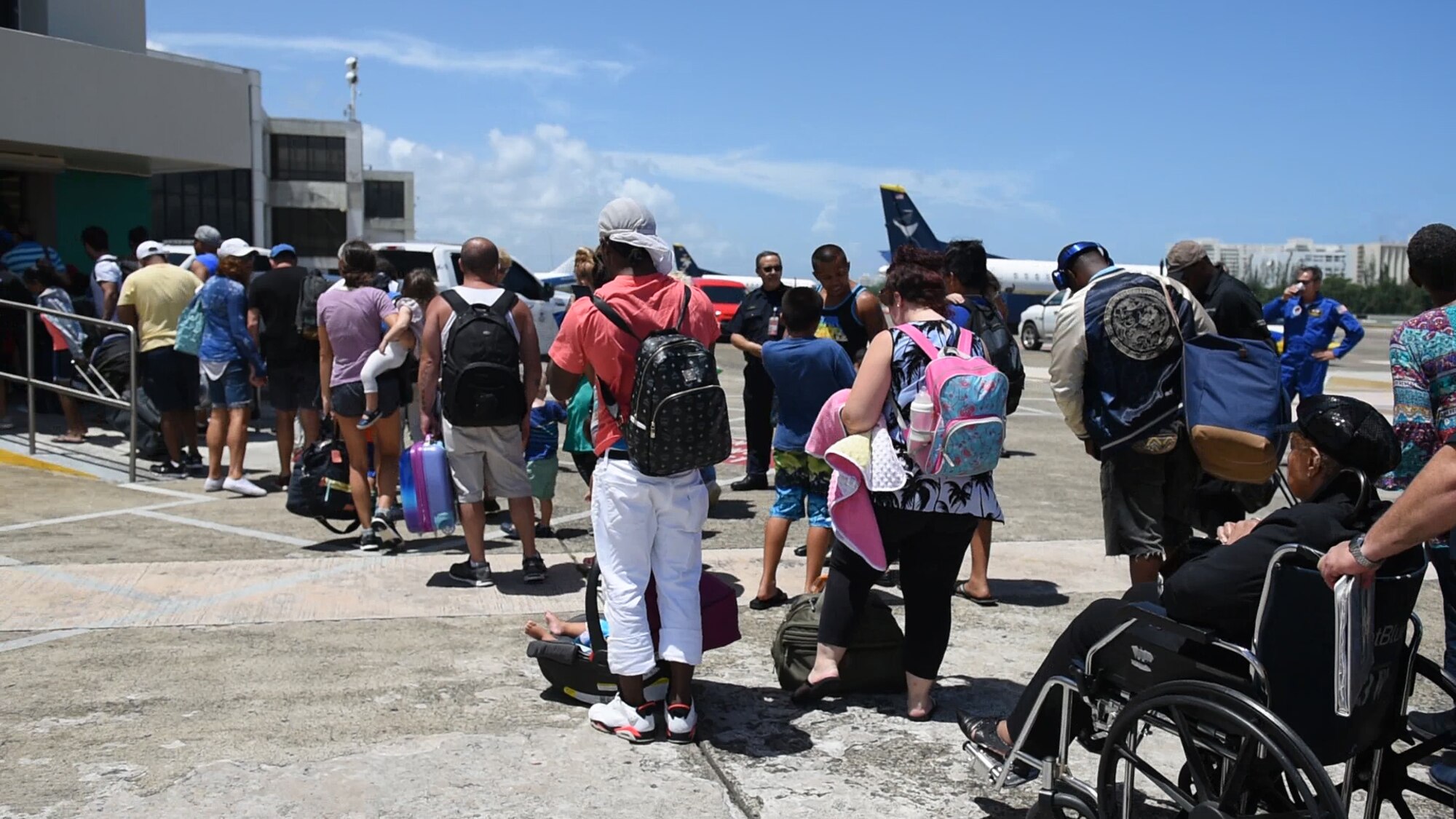 Rescued U.S. citizen from the island of St. Maarten enter the Luis Muñoz Marin International Airport in Carolina, Puerto Rico, Sept.9.