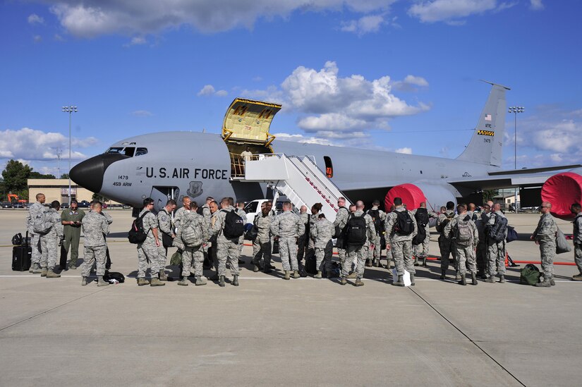 Members of the 113th Wing, D.C. Air National Guard, stand on the flight line in front of a 459th Air Refueling Wing KC-135 Stratotanker at Joint Base Andrews, Maryland, Sept. 9, 2017. Aircrews from the 459th ARW picked up the guardsmen at Tyndall Air Force Base, Florida, earlier in the day due to the threat of Hurricane Irma. (U.S. Air Force photo by Tech. Sgt. Brent A. Skeen)