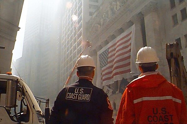 Two Coast Guardsmen stand in New York City.