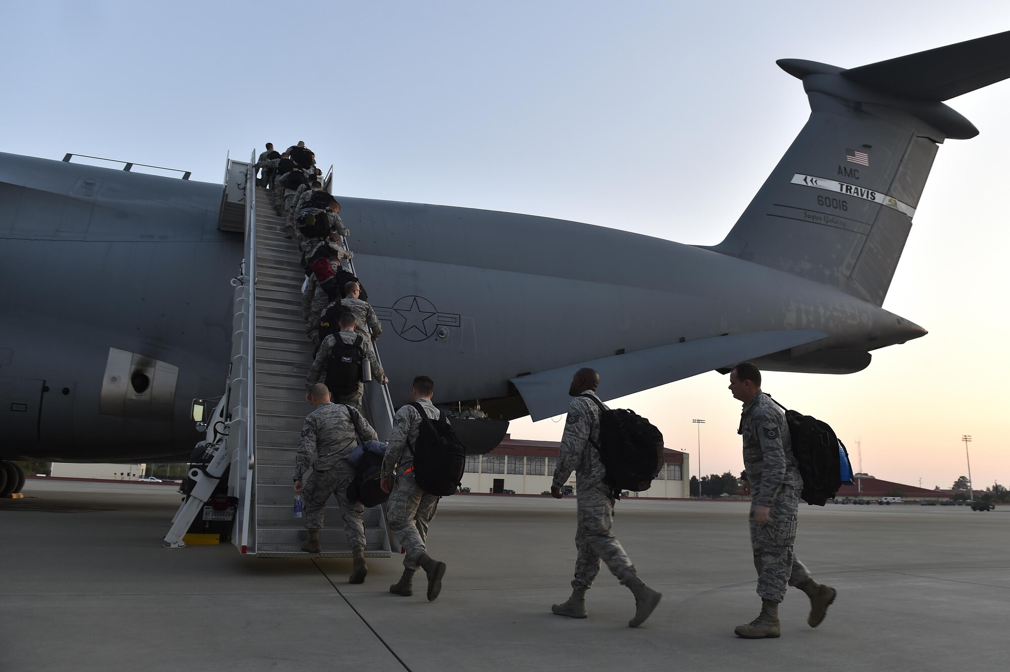 Airmen from the 821st Contingency Response Group board a C-5M Super Galaxy, September 9, 2017, at Travis Airforce Base, Calif.  Two contingency response teams from the 821st Contingency Response Group at Travis Airforce Base, Calif., and a third from the 621st Contingency Response Group at Joint Base McGuire-Dix-Lakehurst, N.J. prepositioned at Scott AFB, to await forward deployment to support ongoing relief efforts in the wake of Hurricane Irma.  (U.S. Air Force photo by Tech. Sgt. Liliana Moreno/Released)