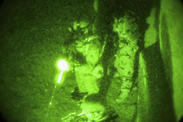 Afghan National Army soldiers with 7th Special Operations Kandak, 215th Corps conduct a notional clearing operation during night casualty evacuation training at Camp Shorabak, Afghanistan, Sept. 10, 2017. Approximately 65 soldiers with the unit rehearsed and refined their CASEVAC procedures at night with assistance from U.S. advisors in preparation for potential real-world missions. (U.S. Marine Corps photo by Sgt. Lucas Hopkins)