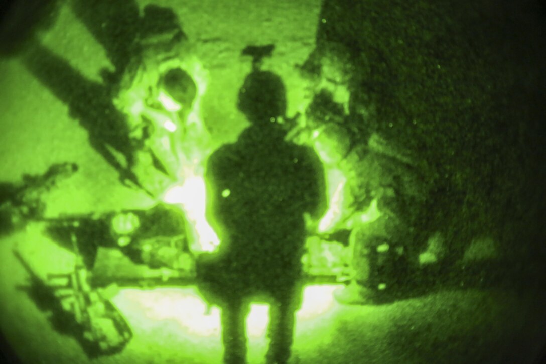 Afghan National Army soldiers with 7th Special Operations Kandak, 215th Corps provide medical care to a notionally wounded soldier during night casualty evacuation training at Camp Shorabak, Afghanistan, Sept. 10, 2017. U.S. advisors assisted their Afghan counterparts throughout the event, which focused on enhancing the soldiers’ CASEVAC procedures and providing a realistic nighttime training environment to prepare the Afghans for real-world scenarios. (U.S. Marine Corps photo by Sgt. Lucas Hopkins)