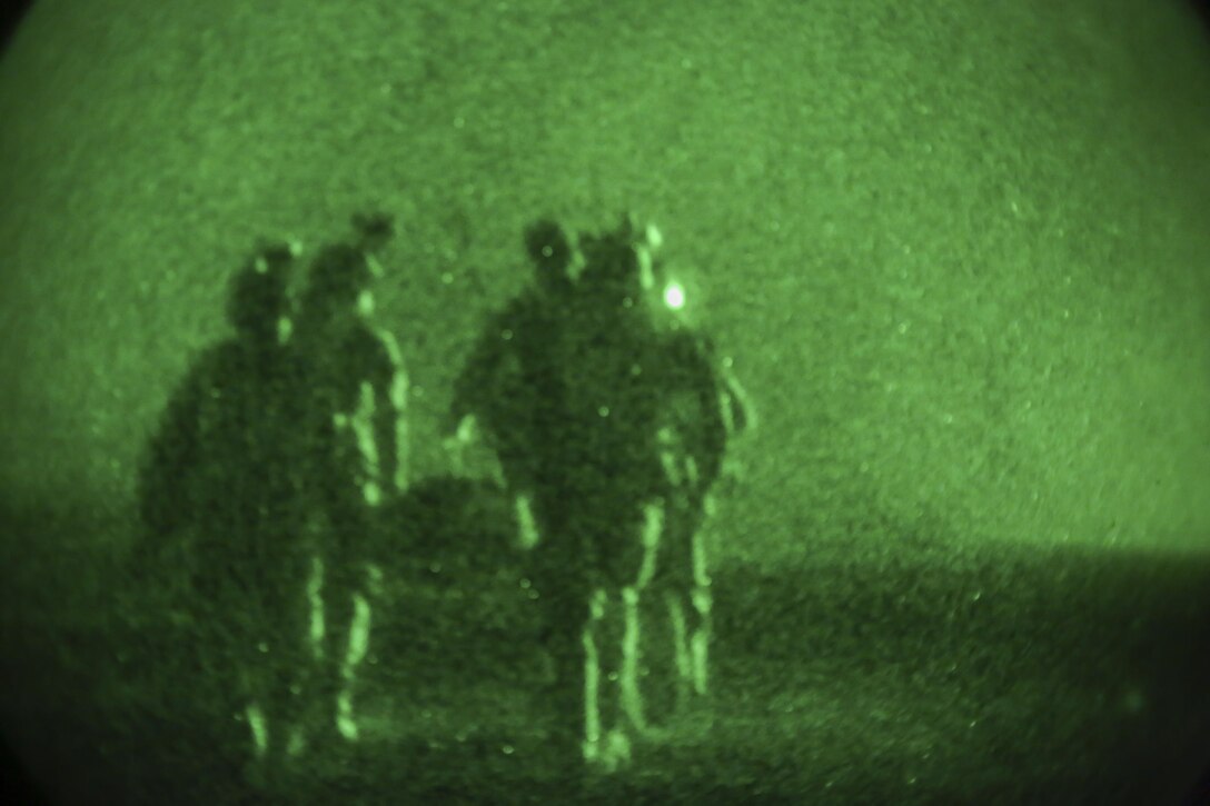 Afghan National Army soldiers with 7th Special Operations Kandak, 215th Corps carry a simulated casualty toward an Afghan Air Force Mi-17 helicopter at Camp Shorabak, Afghanistan, Sept. 10, 2017. Approximately 65 soldiers completed nighttime CASEVAC training, which focused on enhancing their procedures when faced with wounded personnel on the battlefield and providing a realistic training environment in preparation for real-world scenarios. (U.S. Marine Corps photo by Sgt. Lucas Hopkins)