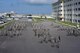 U.S. Airmen, Soldiers, Sailors and Marines gather on the Erwin Professional Military Education Center drill pad for a Sept. 11 remembrance ceremony, Sept. 11, 2017, at Kadena Air Base, Japan. The terror attacks of Sept. 11, 2001, claimed the lives of nearly 3,000 people from 93 nations. The Erwin PME Center conducted a Sept. 11 remembrance ceremony to honor the lives of the victims and first responders lost that day. (U.S. Air Force photo/Senior Airman Omari Bernard)
