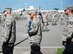 Erwin Professional Military Education Center students carry the U.S. flag at a remembrance ceremony, Sept. 11, 2017, at Kadena Air Base, Japan. During the ceremony, Airmen, Soldiers, Sailors and Marines attending the Erwin PME Center paid respects to the victims of the Sept. 11, 2001, terror attacks and to the fallen service members who lost their lives in the wars that followed. This year marks the 16th anniversary of the Sept. 11, 2001, terror attacks. (U.S. Air Force photo/Omari Bernard)