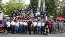 Participants that took part in the Sept. 11 Tower Run pose for a photo after a closing ceremony at Yokota Air Base, Japan, Sept. 8, 2017.