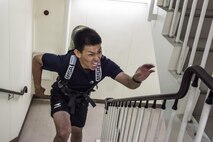 A firefighter from local community runs up a flight of stairs during the Sept. 11 Tower Run at Yokota Air Base, Japan, Sept. 8, 2017.