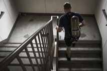 An Airman runs up a flight of stairs during the Sept. 11 Tower Run at Yokota Air Base, Japan, Sept. 8, 2017.