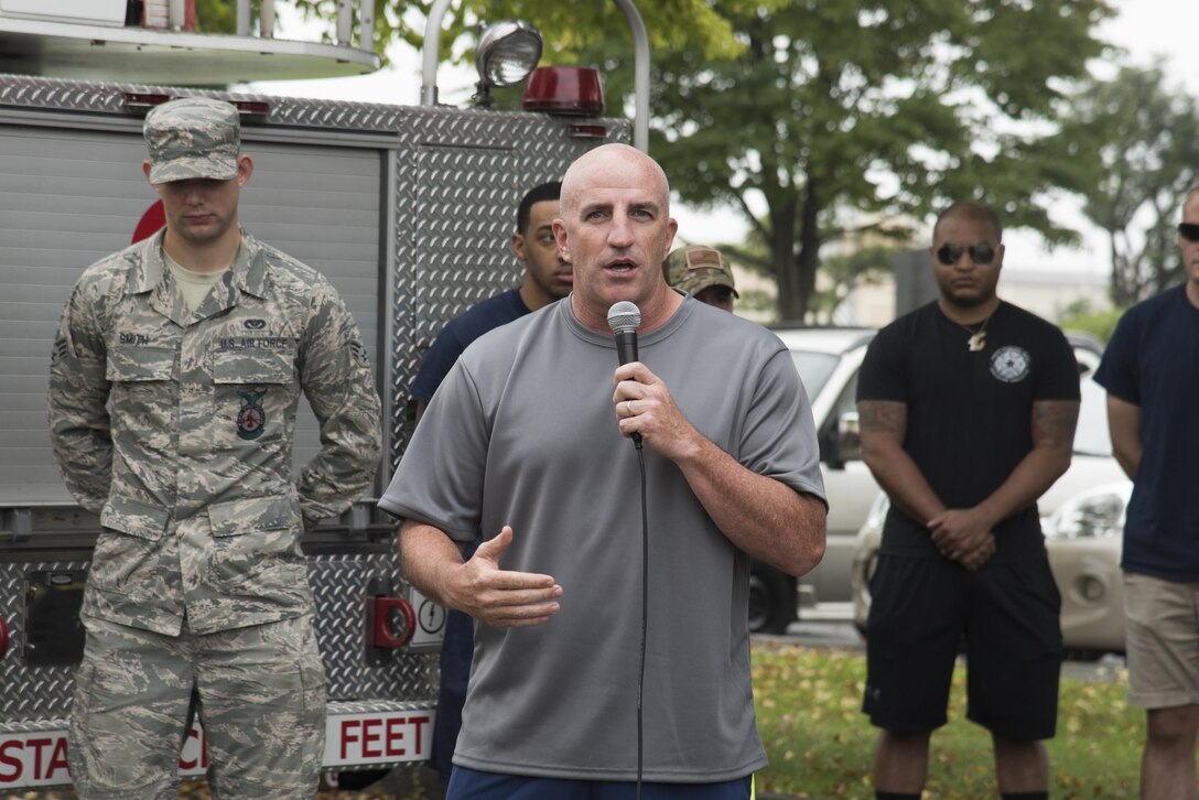 Col. Kenneth Moss, 374th Airlift Wing commander, gives the opening remarks during the Sept. 11 Tower Run at Yokota Air Base, Japan, Sept. 8, 2017.