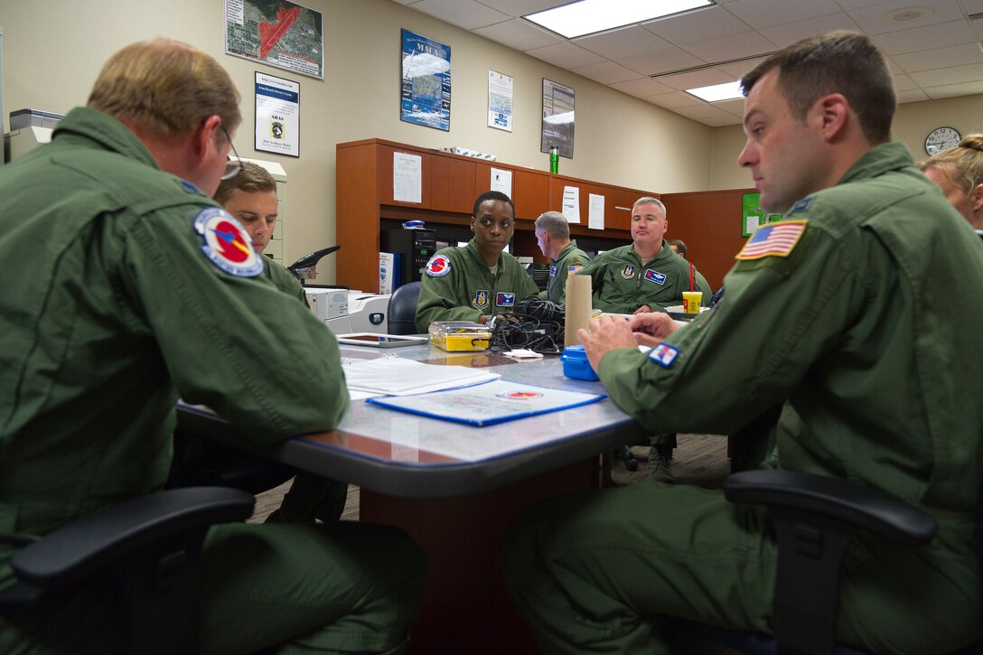 Airmen conduct a preflight briefing before flying into Hurricane Irma