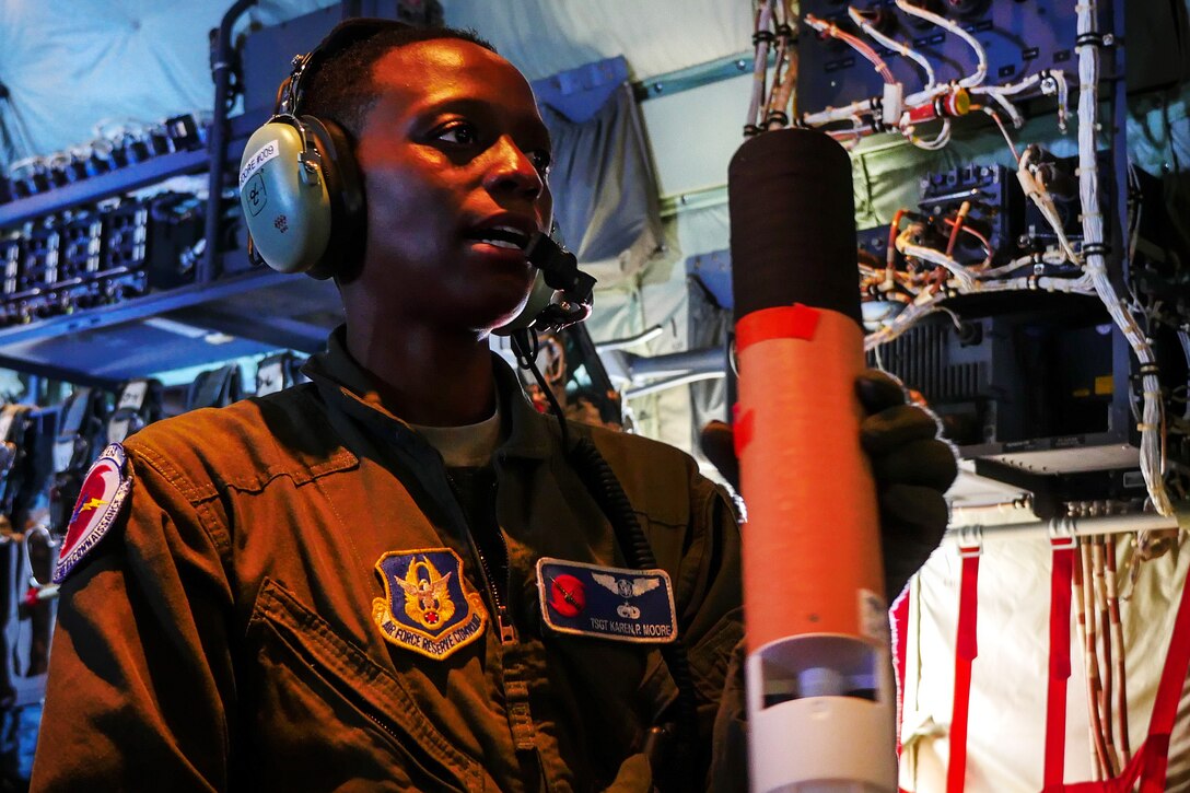 A member of the Air Force holds electronic equipment.