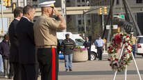 From left, Michigan Sen. Gary Peters, 58, a native of Detroit, John Ellsworth, 45, the father of U.S. Marine Lance Cpl. Justin M. Ellsworth, and Commandant of the Marine Corps Gen. Robert B. Neller honor the wreath of Lance Cpl. Ellsworth at a 9/11 memorial ceremony during Marine Week Detroit, Sept. 10, 2017. Marine Week Detroit is a chance to reconnect with our Marines, sailors, veterans and their families from different generations.
