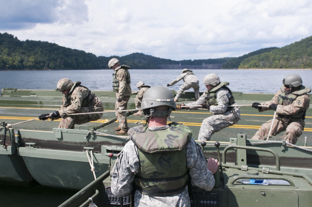 Army reserve Soldiers, with 459th Engineer Company, work to assemble an Improved Ribbon Bridge on the Tygart Lake. The community and local officials were invited to the Tygart Lake State Park Friday, September 8, 2017 to view the unit's bridge building capabilities.