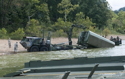Soldiers from the 459th Engineer Company work to disassemble an Improved Ribbon Bridge during training on the Tygart Lake Friday, September 8, 2017. The training exercise was in support of the Department Of Defense’s Immediate Response Authority.