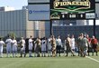 Soldiers assigned to the 354th MPAD, Coraopolis, Pennsylvania, fist bump members of the Point Park University's men's soccer team during a military appreciation game in Pittsburgh September 9, 2017. The 354th MPAD planned a training scenario that allowed the soldiers to practice photography and videography during the game