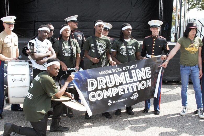 The Cass Tech High School Drum Line, winners of the Marine Week Detroit Drum Line Competition, pose for a group photo during Marine Week Detroit Sep. 9, 2017. The Marine Corps Recruiting hosted many events during Marine Week Detroit as a part of their City Partnership Program. MCRC City Partnerships seek to align the Marine Corps with cities that share the essence of Marines - an irreducible fighting spirit. Some events hosted included High School visits supported by the Silent Drill Platoon, a Community Leaders Reception, a photography competition showcasing Detroit's fighting spirit, youth basketball and wrestling clinics, three on three basketball tournament, a cooking competition featuring an Expeditionary Field Kitchen, and more. MCRC leveraged existing partnerships with USA Wrestling, Women's Basketball Coaches Association and local contacts in the city to create events in celebration of the emerging partnership. Other City Partnerships in development include Baltimore, New Orleans, Chicago, Dallas, and Oakland, California. (U.S. Marine Corps photo by Sgt. Nathan Wicks)