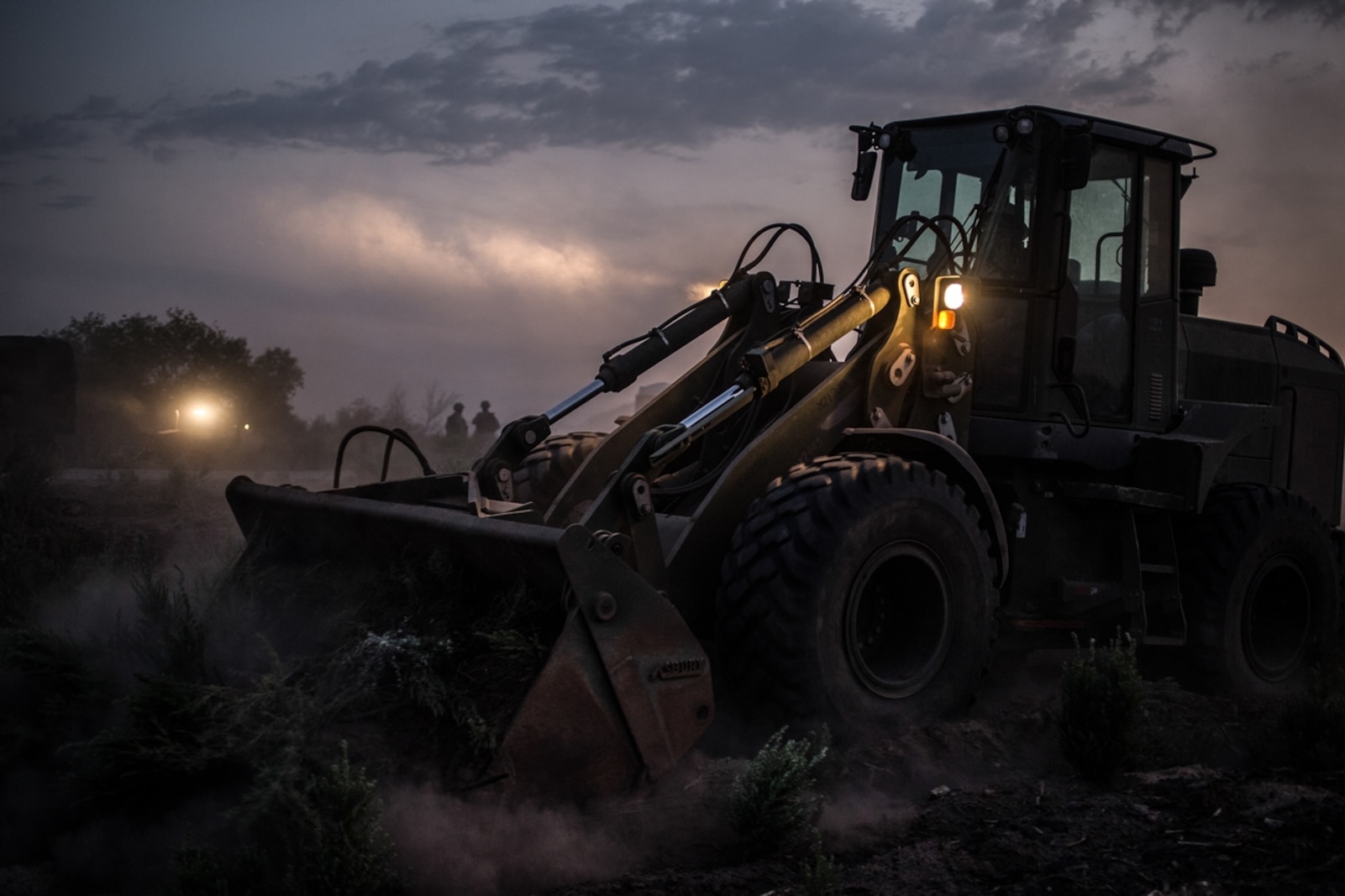 U.S. Marine Cpl. Angelica Mcfarlin, a heavy equipment operator with Support Company, 7th Engineer Support Battalion, 1st Marine Logistics Group, moves shrubbery during Exercise Deep Strike II at Blythe, Calif., Sept. 6, 2017. Tractor Rubber Articulated Multi-terrain vehicles are used to move heavy equipment or clear debris while conducting field exercises. (U.S. Marine Corps photo by Lance Cpl. Timothy Shoemaker)