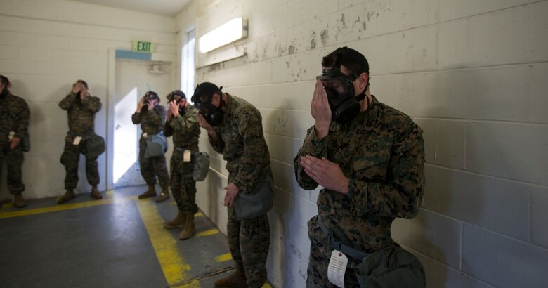 Marines and Sailors with 2nd Medical Battalion air out their uniforms during a quarterly gas chamber qualification on Camp Lejeune, N.C., Sept. 8, 2017.