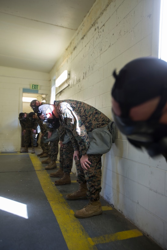 Marines and Sailors with 2nd Medical Battalion air out their uniforms during a quarterly gas chamber qualification on Camp Lejeune, N.C., Sept. 8, 2017.