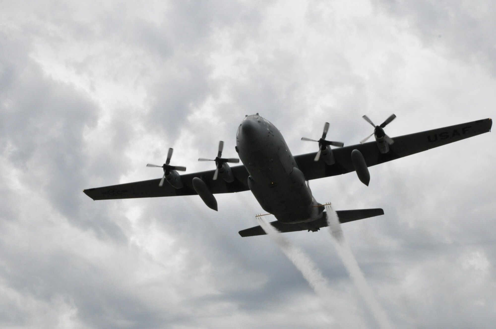 A modified U.S. C-130 aircraft, assigned to the 910th Airlift Wing, sprays water simulating a pesticide solution during a field exercise as part of the Department of Defense Aerial Spray Certification Course, Jan. 13, 2016. The 910th Airlift Wing has been tasked with providing its unique aerial spray capability to assist with recovery efforts in eastern Texas, following the devastation of Hurricane Harvey. Youngstown Air Reserve Station's 910th Airlift Wing is home to DoD’s only aerial spray mission.
