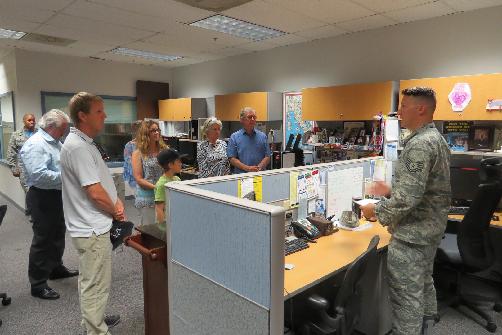 Technical Sgt. Blake Butzer shows a group of family members through the 91st Cyberspace Operations Squadron spaces during an Open House Aug. 25 at Joint Base San Antonio-Lackland, Texas, in support of the 91st COS Centennial. During this event family and friends were treated to snacks, a mission briefing, and a tour of the unit. (Courtesy photo)