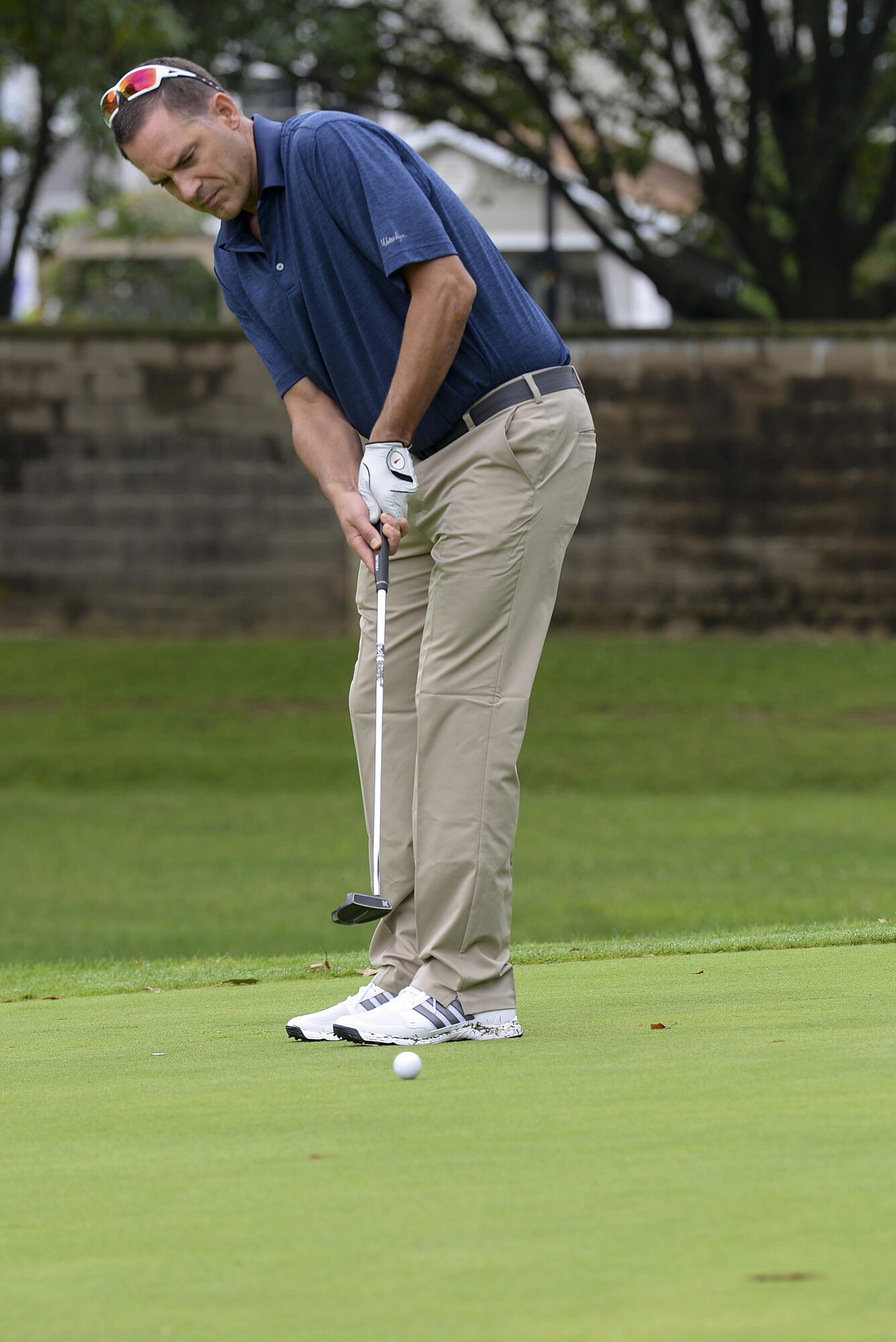 Col. Ethan Griffin, 436th Airlift Wing commander, puts a golf ball Sept. 7, 2017, during the Bluesuiters’ Golf Tournament at Eagle Creek Golf Course on Dover Air Force Base, Del. The tournament paired Airmen from the base with local community leaders to foster partnerships in a relaxed setting. (U.S. Air Force photo by Staff Sgt. Aaron J. Jenne)
