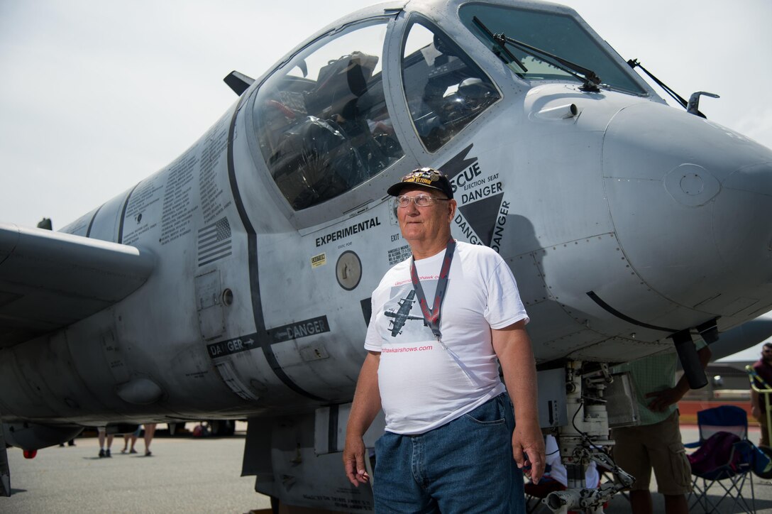 Wayne Klotz, an Army veteran, stands next to an Army OV-1 Mohawk observation and surveillance aircraft Aug. 27, 2017, during the Thunder Over Dover Open House at Dover Air Force Base, Del. One of the static displays at the open house, Mohawk Airshows’ plane, is the first flying POW/MIA monument, and is covered in names of service members who died during the Vietnam War and were never recovered from Southeast Asia. (U.S. Air Force photo by Mauricio Campino)