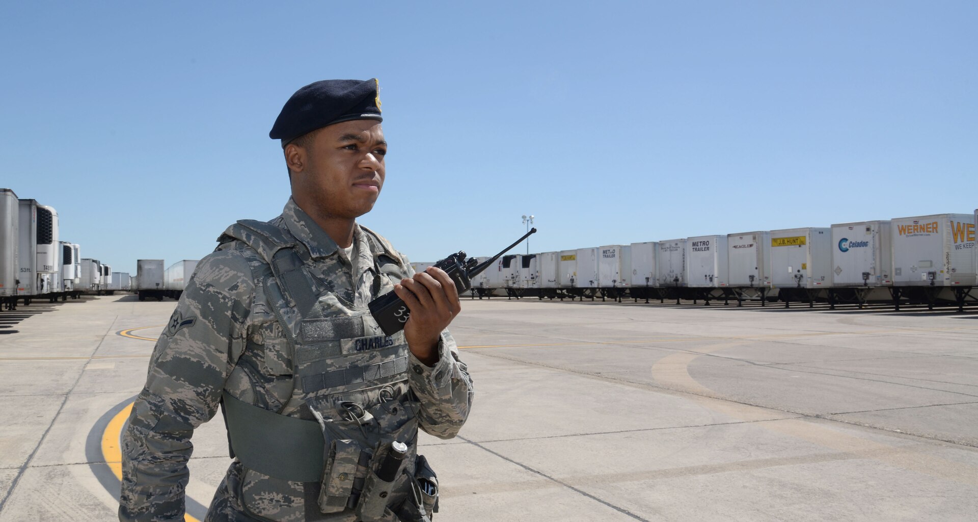 Amn Malcolm Charles, 902nd Security Forces Squadron entry controller, sends a situation report of the Incident Support Base where Federal Emergency Management Agency disaster relief trucks are parked at Joint Base San Antonio-Randolph, Texas, September 7, 2017.