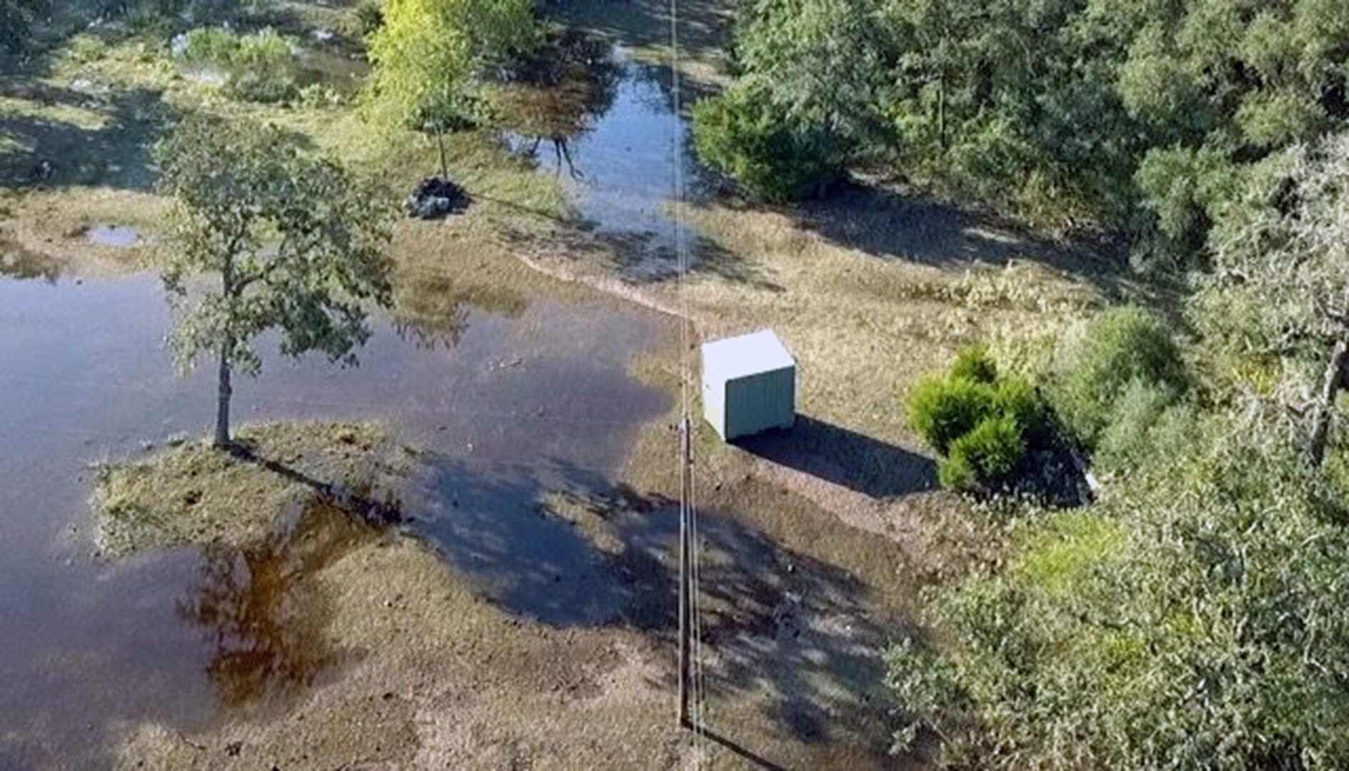 An aerial photo taken by a drone belonging to Maj. Michael Stump, U.S. Army South fire support officer, of flooded ranch in Ezzell, Texas, affected by Hurricane Harvey. The aerial footage was used by the Guadalupe Valley Electric Cooperative to determine if there was a disruption of power to residents in the area.