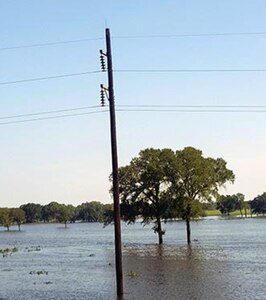An aerial photo taken by a drone belonging to Maj. Michael Stump, U.S. Army South fire support officer, of a power line running into Ezzell, Texas, standing in several feet of flooded water as a result of Hurricane Harvey devastation to the area.