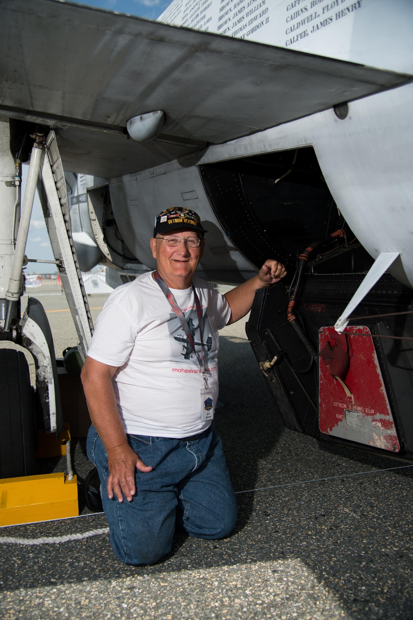 Wayne Klotz, an Army veteran, shows where the camera film was fitted on an Army OV-1 Mohawk observation and surveillance aircraft Aug. 27, 2017, during the Thunder Over Dover Open House at Dover Air Force Base, Del. Klotz operated the camera and reconnaissance instruments in an OV-1 during the Vietnam War. (U.S. Air Force photo by Mauricio Campino)