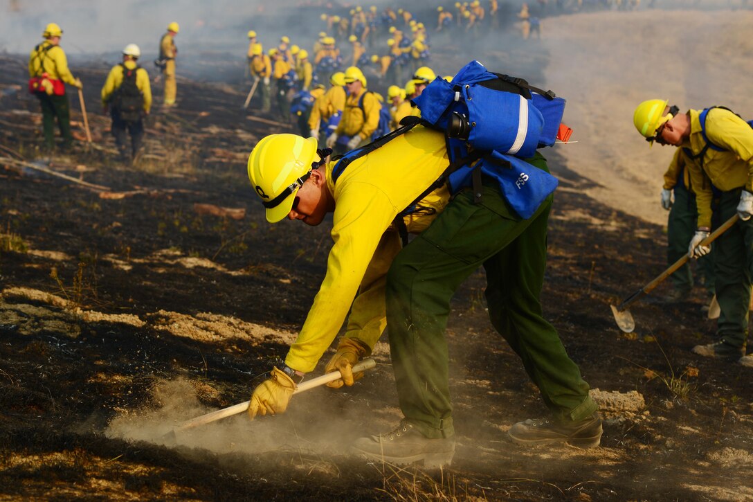 Oregon Army National Guard Pfc. Solomon Quijano, with Bravo Battery, 2nd Battalion, 218th Field Artillery Regiment, checks for hot spots during a firefighting training exercise at the Oregon Department of Public Safety Standards and Training in Salem, Ore., Aug. 28, 2017. Nearly 125 citizen-soldiers from the 41st Infantry Brigade Combat Team volunteered to join the second iteration of personnel, also known as NG-2, activated by Gov. Kate Brown to assist with wildfires across the state of Oregon. The Oregon National Guard is currently assigned to three different fires in central and southern Oregon; the Whitewater, High Cascades Complex, and Chetco Bar fires. Oregon Army National Guard photo by Sgt. 1st Class April Davis