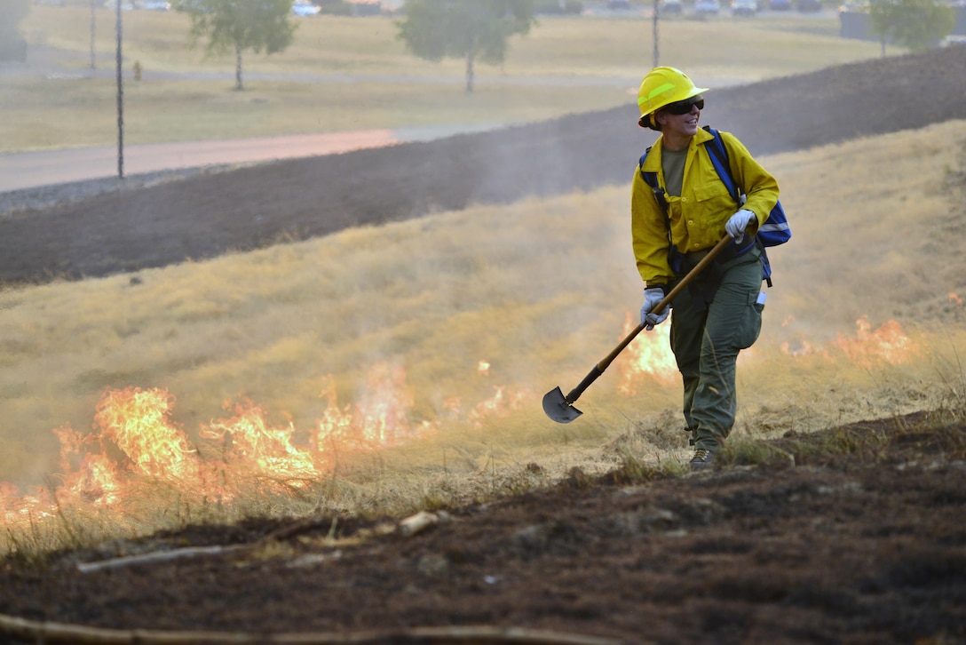 An Oregon Army National Guardsman from the 41st Infantry Brigade Combat Team experiences the heat of a controlled burn during a field training exercise at the Oregon Department of Public Safety Standards and Training in Salem, Ore., Aug. 28, 2017. The exercise was part of a four-day mandatory certification course before National Guard troops can be dispatched to fight wildfires across the state. Oregon Army National Guard photo by Capt. Leslie Reed