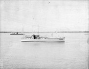 IMAGE: 9/11/1944
MARITIME HISTORY: Barge in background, YP-66 Boat with 2 sailors, small sailboat in right background